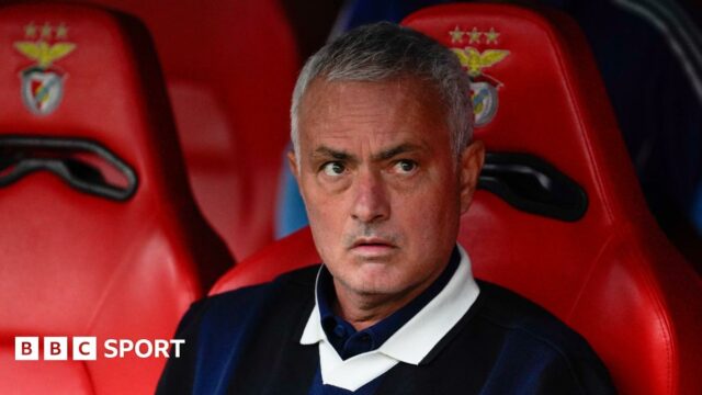 Manager Jose Mourinho sitting in the dugout at Benfica while Fenerbahce boss
