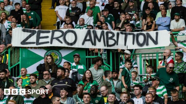 Celtic fans display a banner
