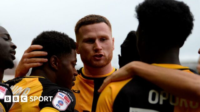 Newport County players celebrate scoring against Gillingham 