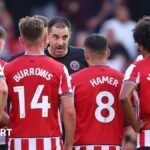 Sheffield United boss Ruben Selles gives his squad a teamtalk on the pitch