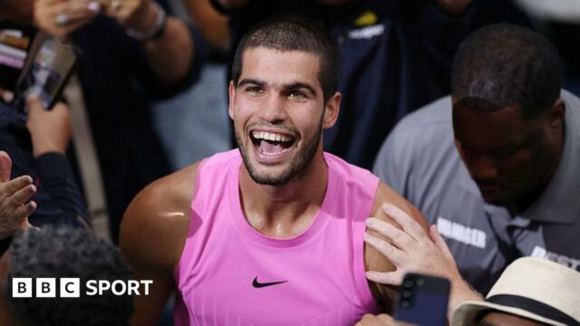 Carlos Alcaraz smiles after winning the US Open