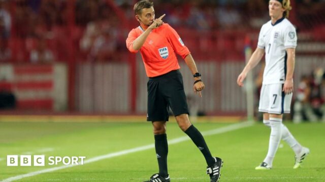 Referee Clement Turpin points to the stands during England's World Cup qualifier with Serbia in Belgrade