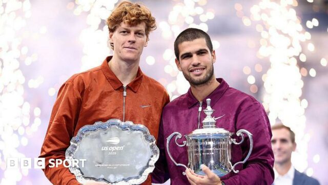 Jannik Sinner and Carlos Alcaraz show off their trophies after the US Open