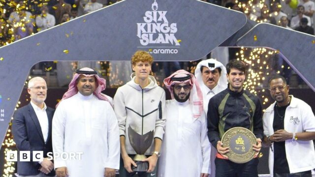 Jannik Sinner holds the Six Kings Slam trophy after his victory over Carlos Alcaraz in the 2024 final