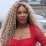 Serena Williams' daughter photobombs her as she poses in bold red dress image