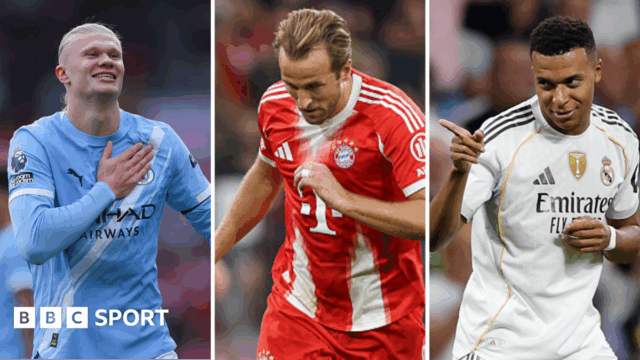 Harry Kane claps while playing for England