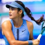 Emma Raducanu hits a forehand