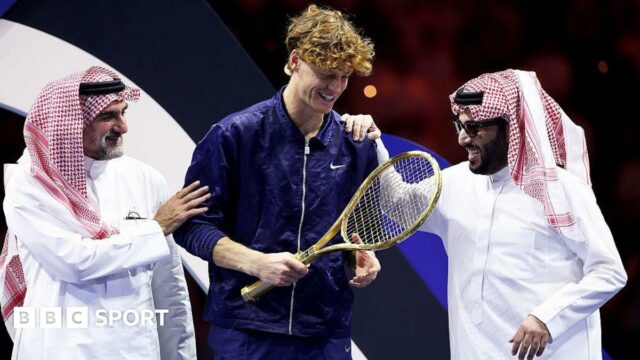 Jannik Sinner with Yasir Al-Rumayyan and Turki Al-Sheikh after winning the Six Kings Slam
