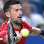 Novak Djokovic plays a forehand against Marin Cilic at the Shanghai Masters