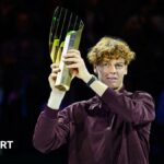Jannik Sinner of Italy poses with his Vienna Open trophy