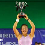 Mimi Xu holds the Wrexham Open trophy aloft
