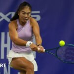 Mimi Xu hits a backhand shot at the Wrexham Open