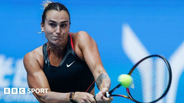Aryna Sabalenka strikes a tennis ball at the Wuhan Open 