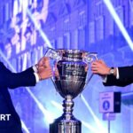 Carlos Alcaraz and Jannik Sinner pose with the ATP year-end number one trophy