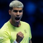 Carlos Alcaraz celebrates with a clenched fist