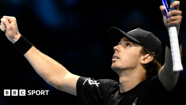 Alex de Minaur celebrates his victory against Taylor Fritz at the ATP Finals
