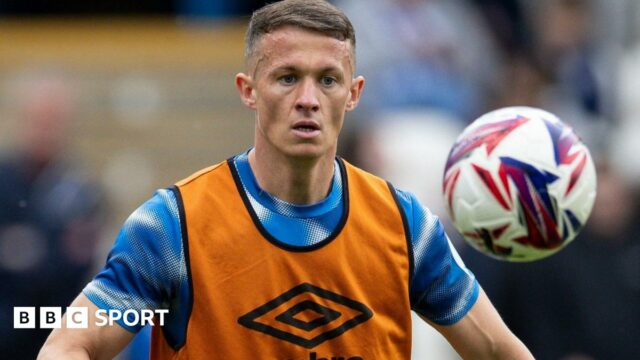 Jonathan Hogg warms up before a match for Huddersfield Town