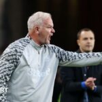 Adi Viveash making a gesture with his left-hand during Middlesbrough's win over Birmingham City with Blue head coach Chris Davies in the background