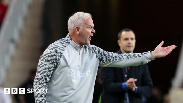 Adi Viveash making a gesture with his left-hand during Middlesbrough's win over Birmingham City with Blue head coach Chris Davies in the background