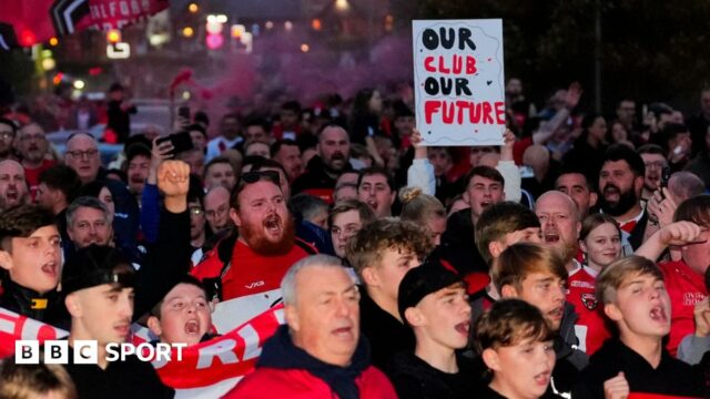 Salford Red Devils fans protest before their game against St Helens towards the end of the 2025 season