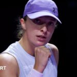 Iga Swiatek celebrates after beating Madison Keys