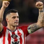 Granit Xhaka celebrates while playing for Arsenal