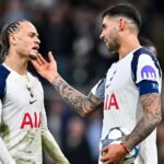 Xavi Simons pleads to Cristian Romero to be able to take the second penalty during the Champions League match between Tottenham Hotspur and Slavia Prague