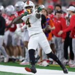 Mark Fletcher Jr. z Miami Hurricanes reaguje po prvom prepade proti štátu Ohio