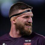 Bývalá hviezda Queensland Origin Josh McGuire čelí obvineniam z uškrtenia a bežného napadnutia, údajne proti dieťaťu.