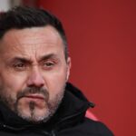 Cristian Romero z Tottenhamu Hotspur reaguje