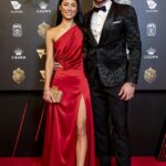 Víťaz premiéry Melbourne Demons Steven May (na snímke s partnerom Sachi Dade) odhalil duševné zrútenie, ktoré podnietilo jeho šokový odchod do dôchodku.