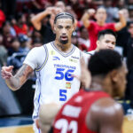 Chris McCullough z TNT Tropang 5G počas zápasu 7 proti Justinovi Brownleemu a Barangay Ginebra Gin Kings vo finále PBA Commissioner's Cup v roku 2026.